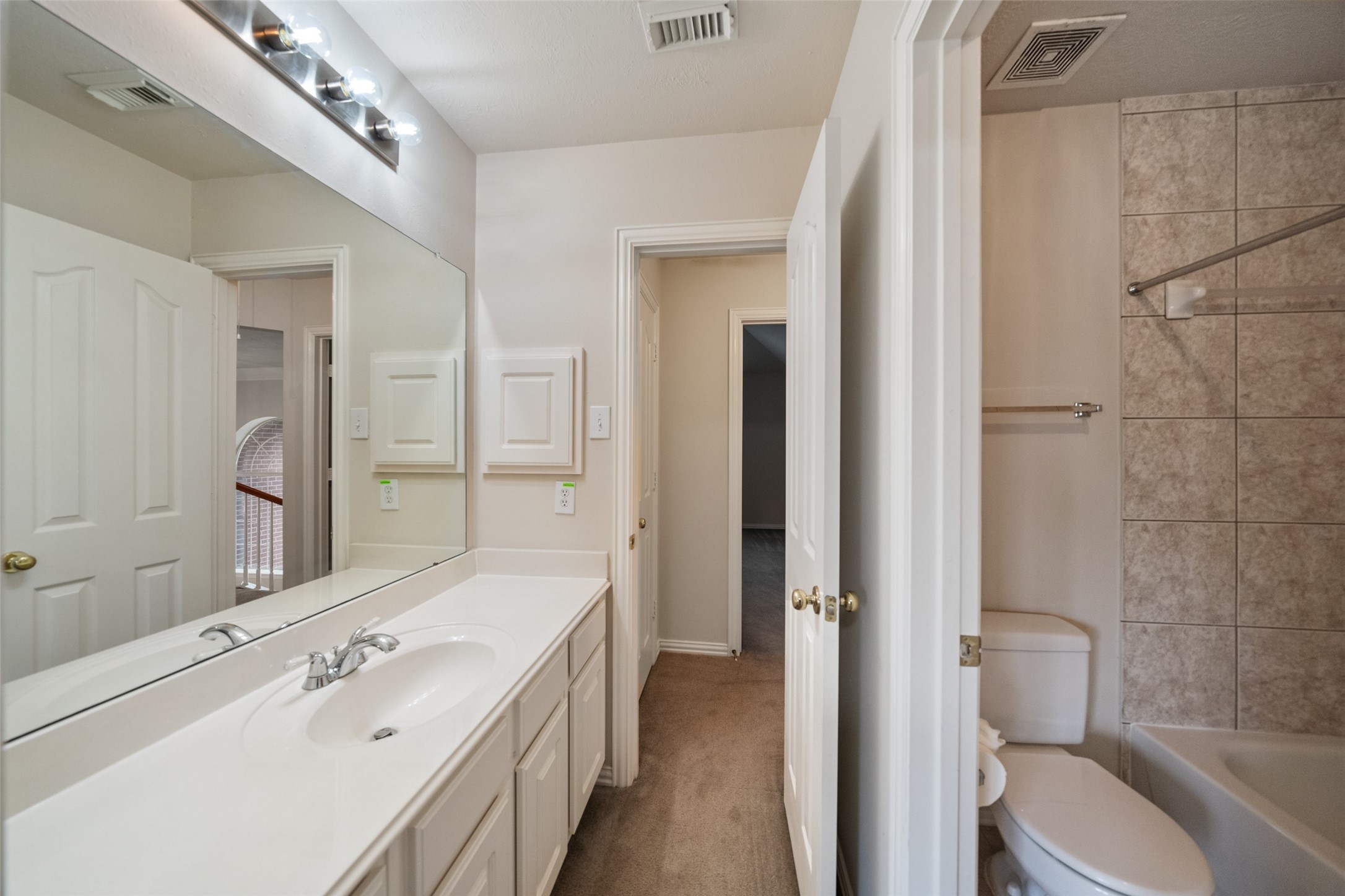 14803 Ramblebrook Humble, TX 77396 - Photo 39 of 45 a bathroom with a tub sink and toilet
