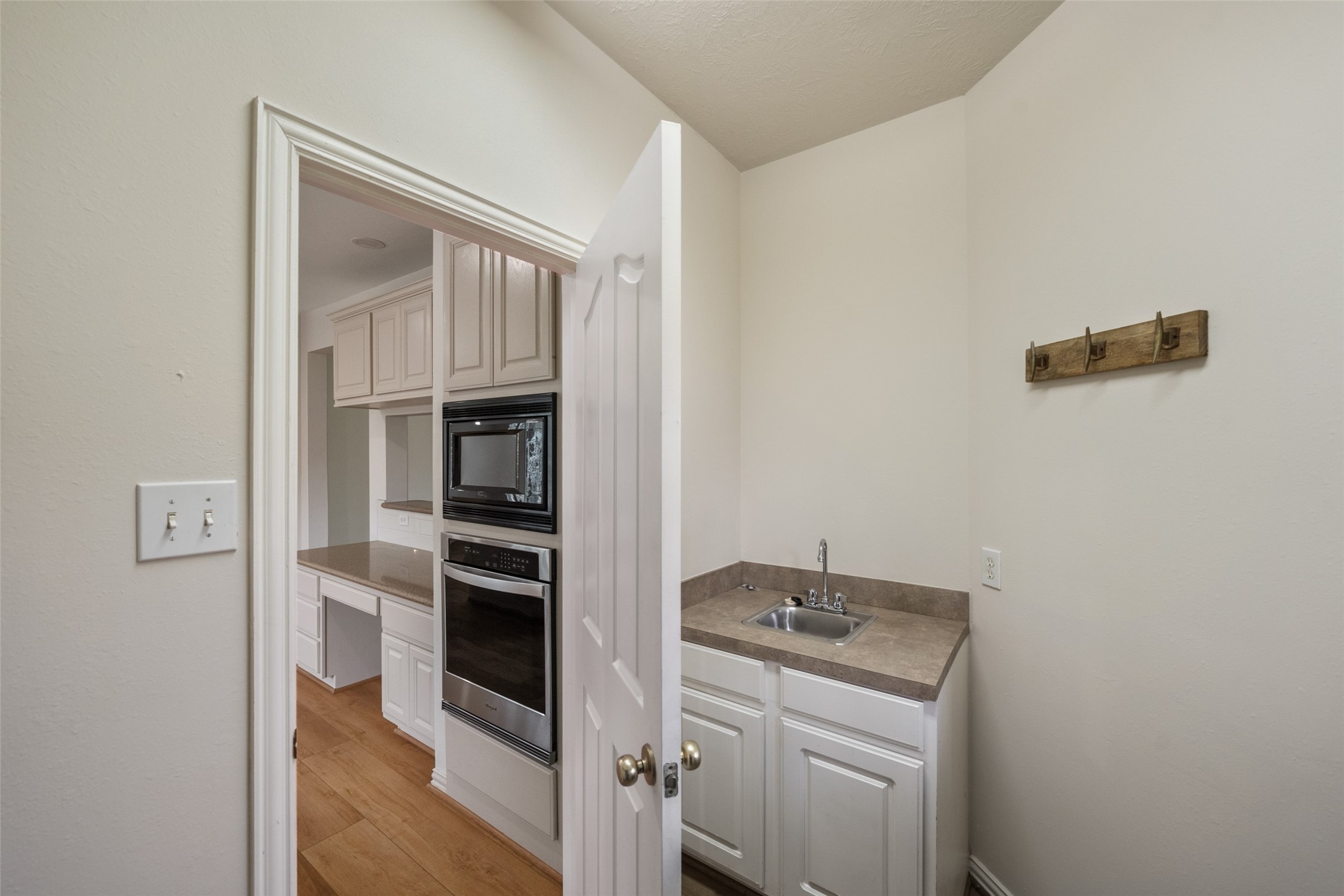 14803 Ramblebrook Humble, TX 77396 - Photo 41 of 45 a kitchen with a refrigerator and cabinets