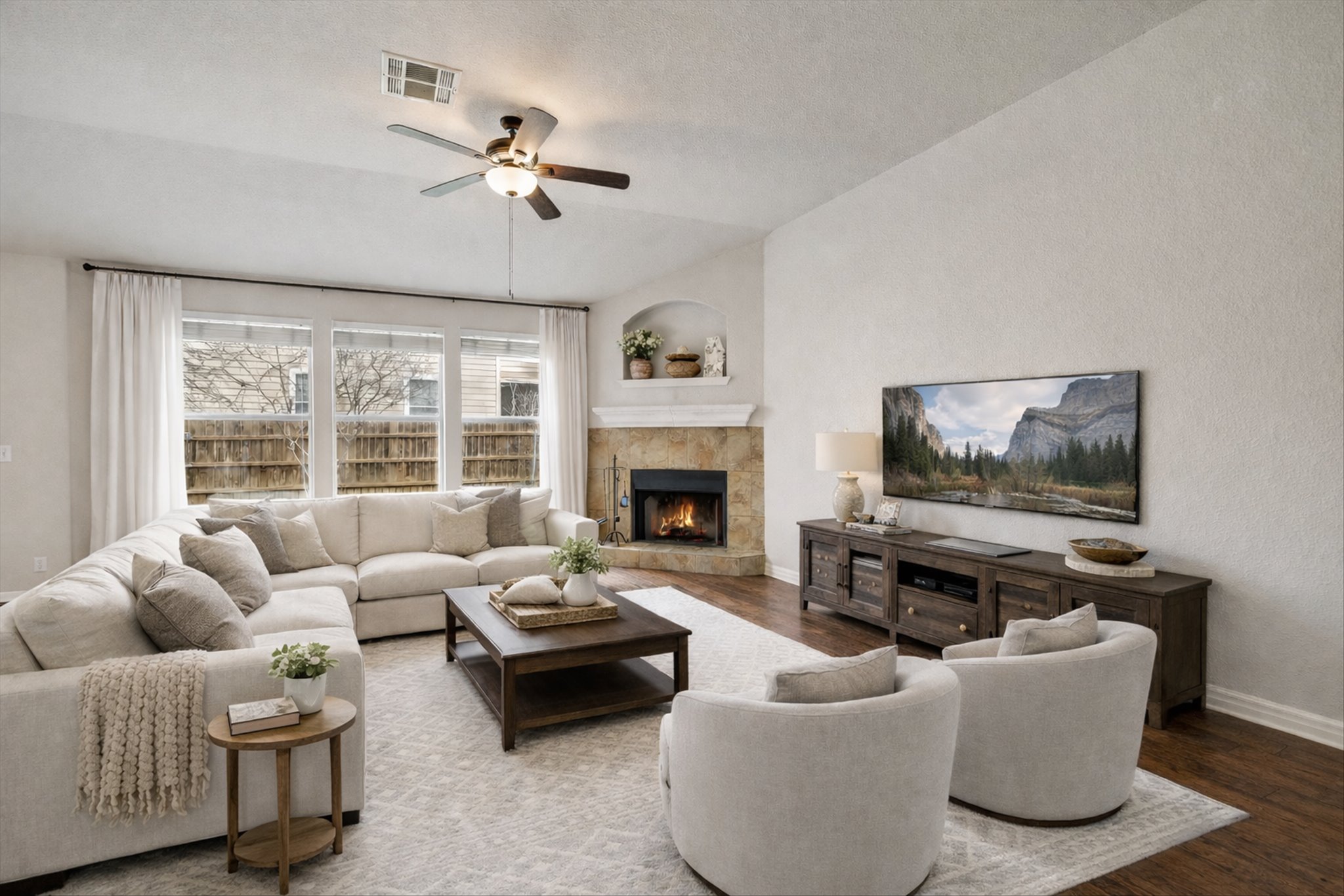 9616 Magna Carta Loop Austin, TX 78754 - Photo 2 of 28 a living room with furniture and a fireplace