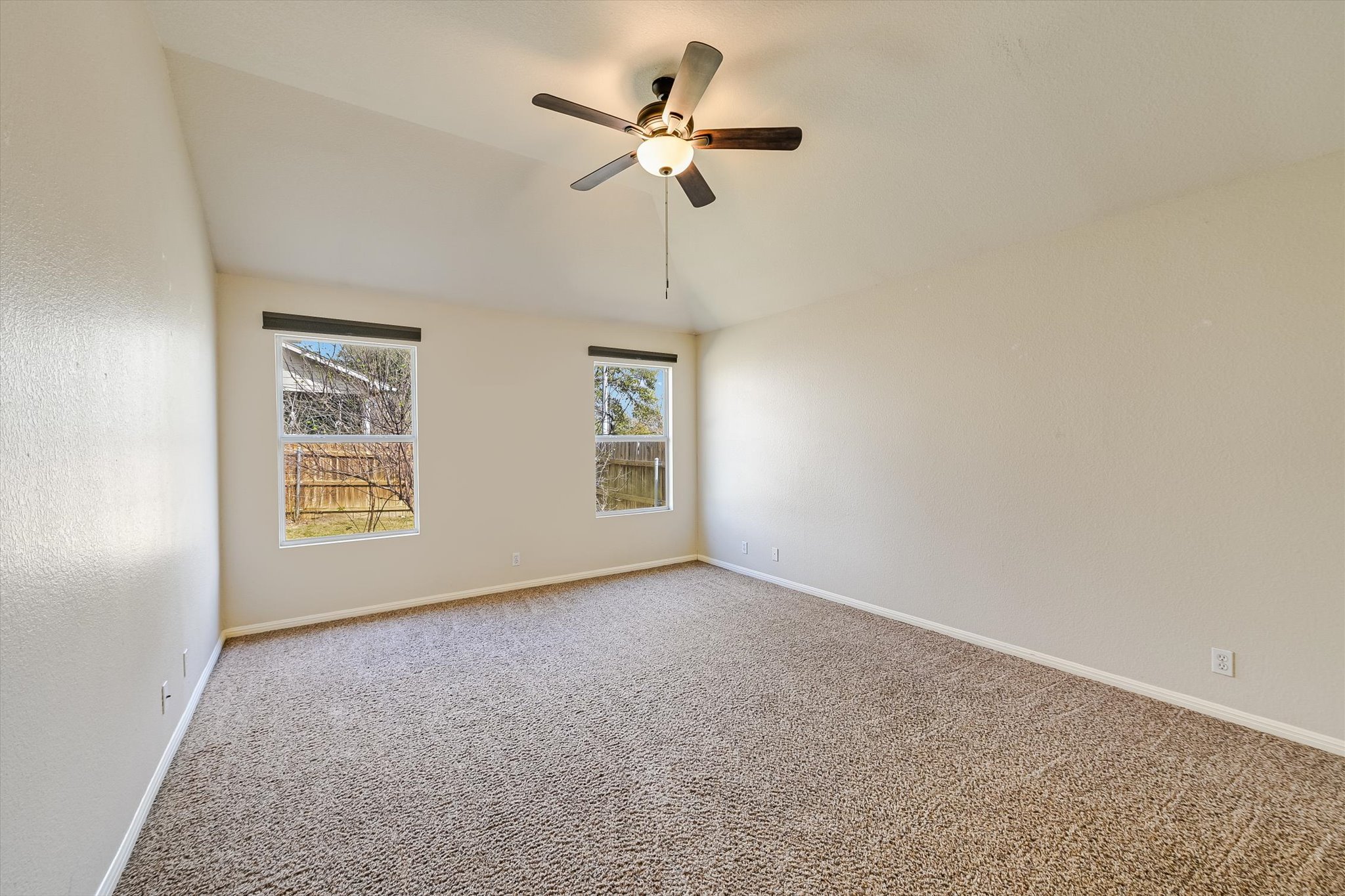 9616 Magna Carta Loop Austin, TX 78754 - Photo 20 of 28 an empty room with windows and fan