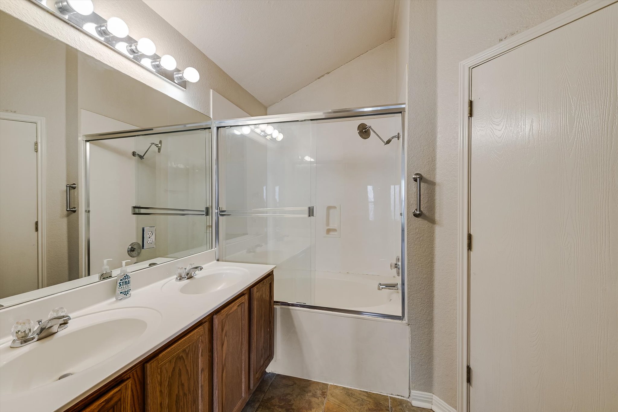 9616 Magna Carta Loop Austin, TX 78754 - Photo 22 of 28 a bathroom with a double vanity sink mirror and shower