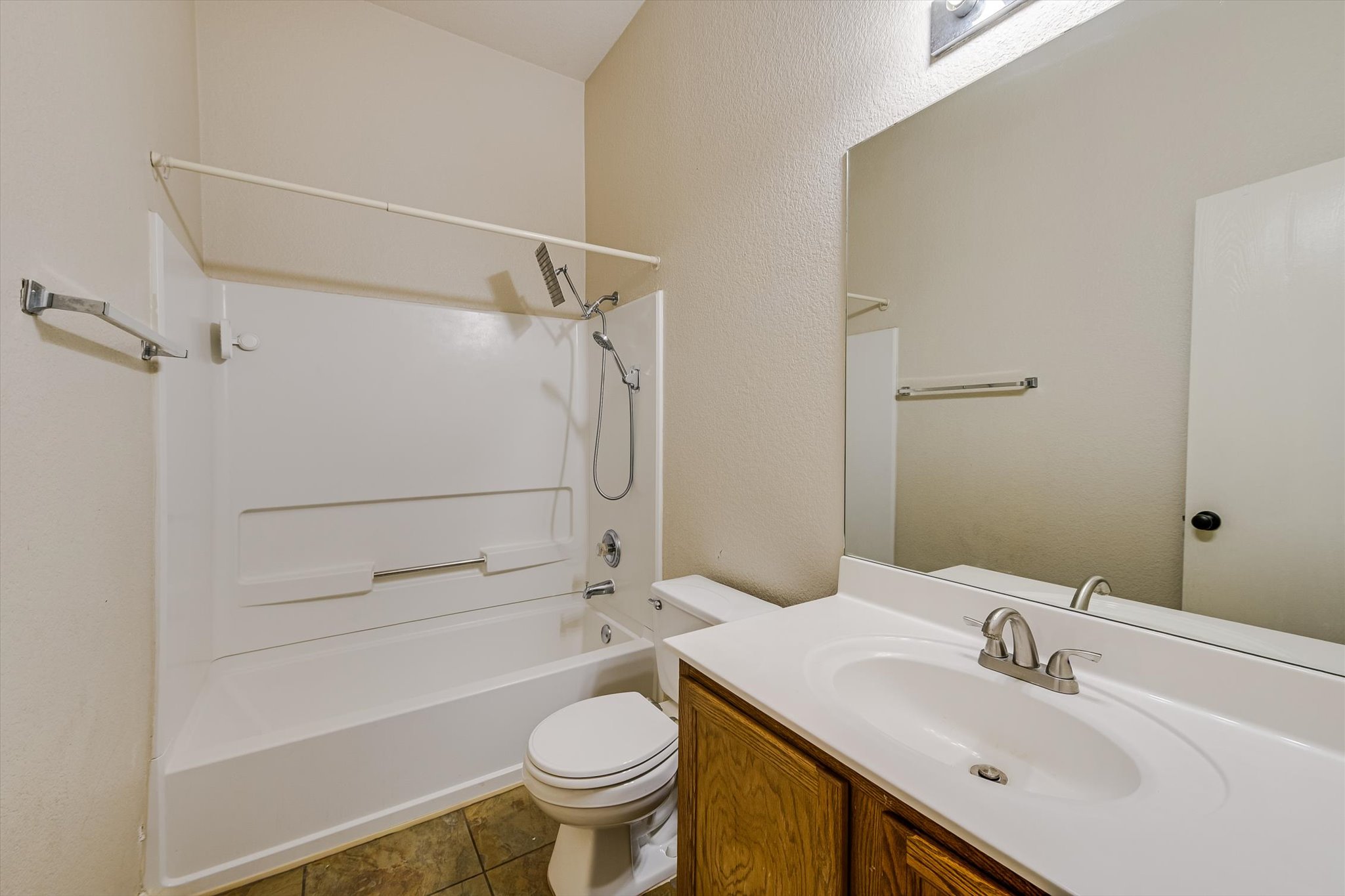 9616 Magna Carta Loop Austin, TX 78754 - Photo 24 of 28 a bathroom with a sink toilet and shower