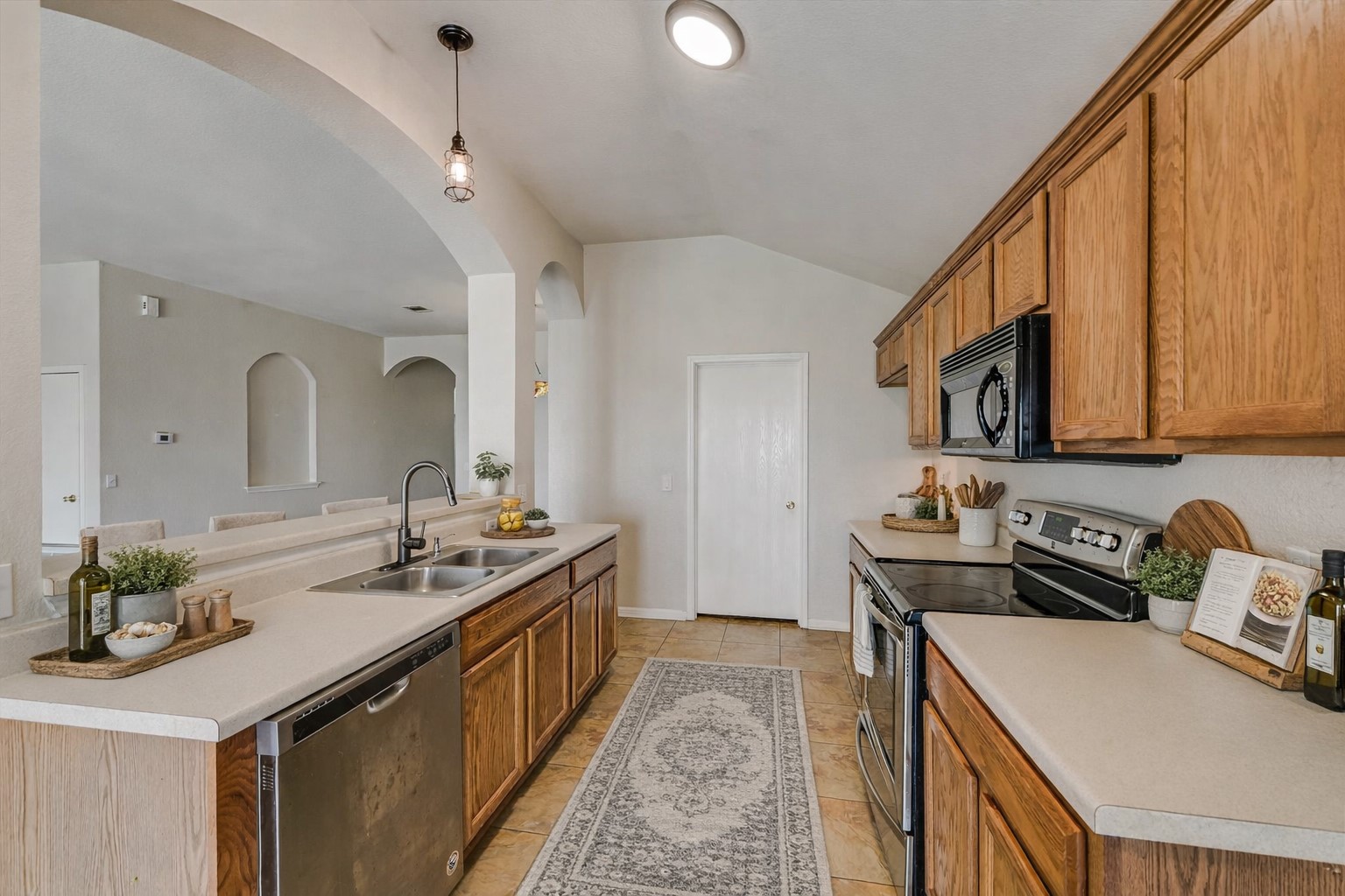 9616 Magna Carta Loop Austin, TX 78754 - Photo 4 of 28 a kitchen with sink stove and cabinets
