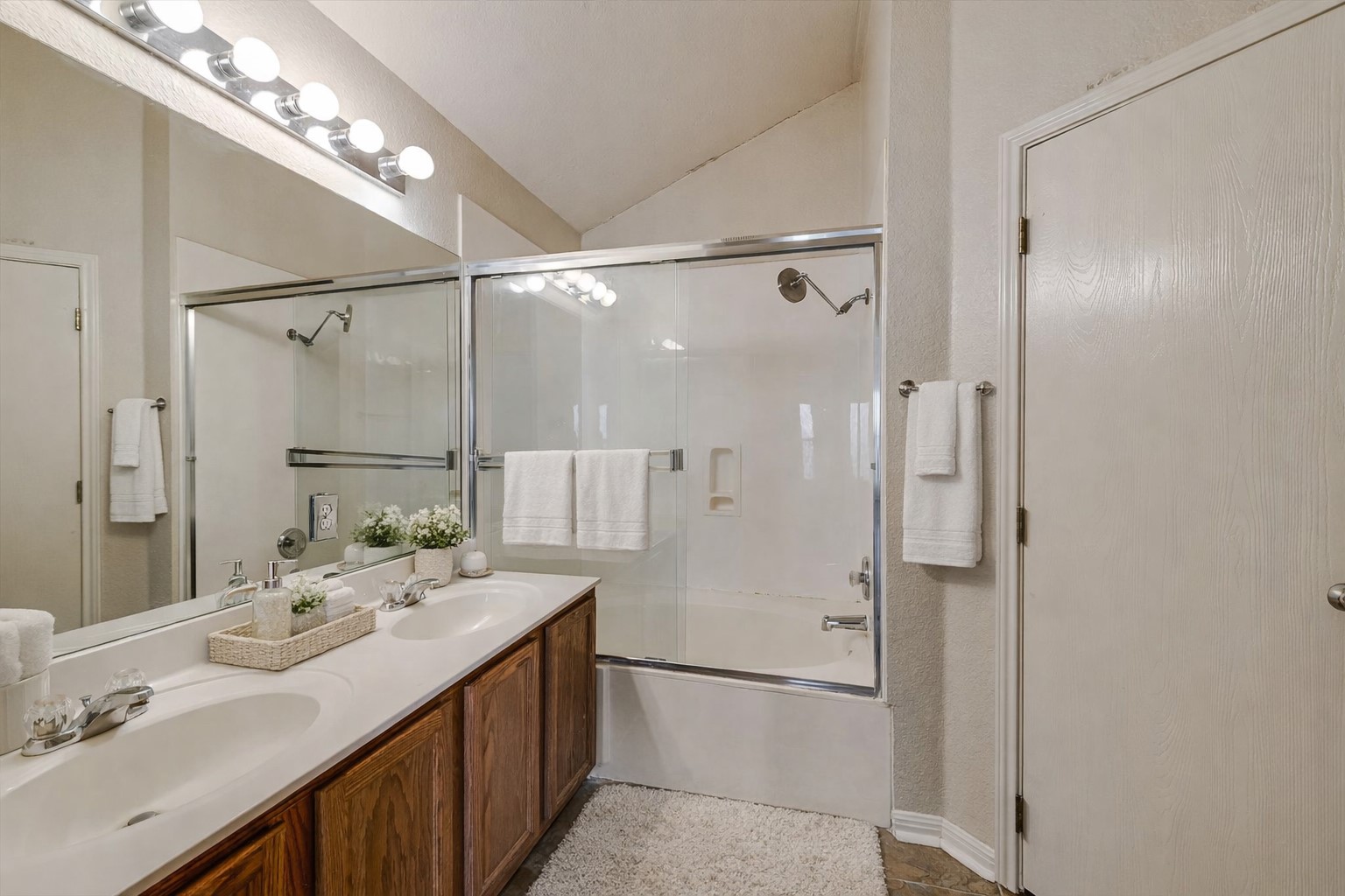 9616 Magna Carta Loop Austin, TX 78754 - Photo 7 of 28 a bathroom with a double vanity sink mirror and double