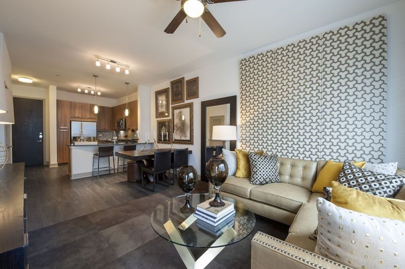 2111 Westheimer Road, Unit 2301 Houston, TX 77098 - Photo 2 of 14 a living room with furniture and a large mirror