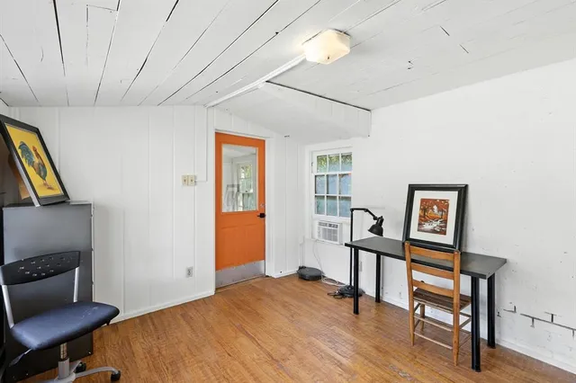 a bedroom with furniture and a window