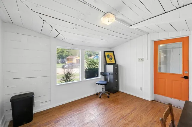 a room with gym equipment and a window