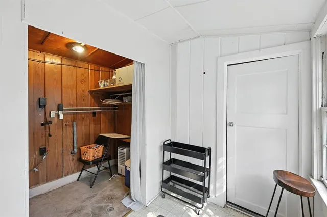 a view of room with chairs and closet