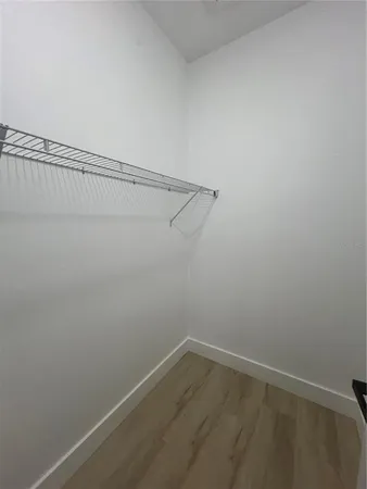a view of a room with racks on the wall