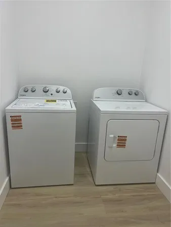 a utility room with dryer and washer