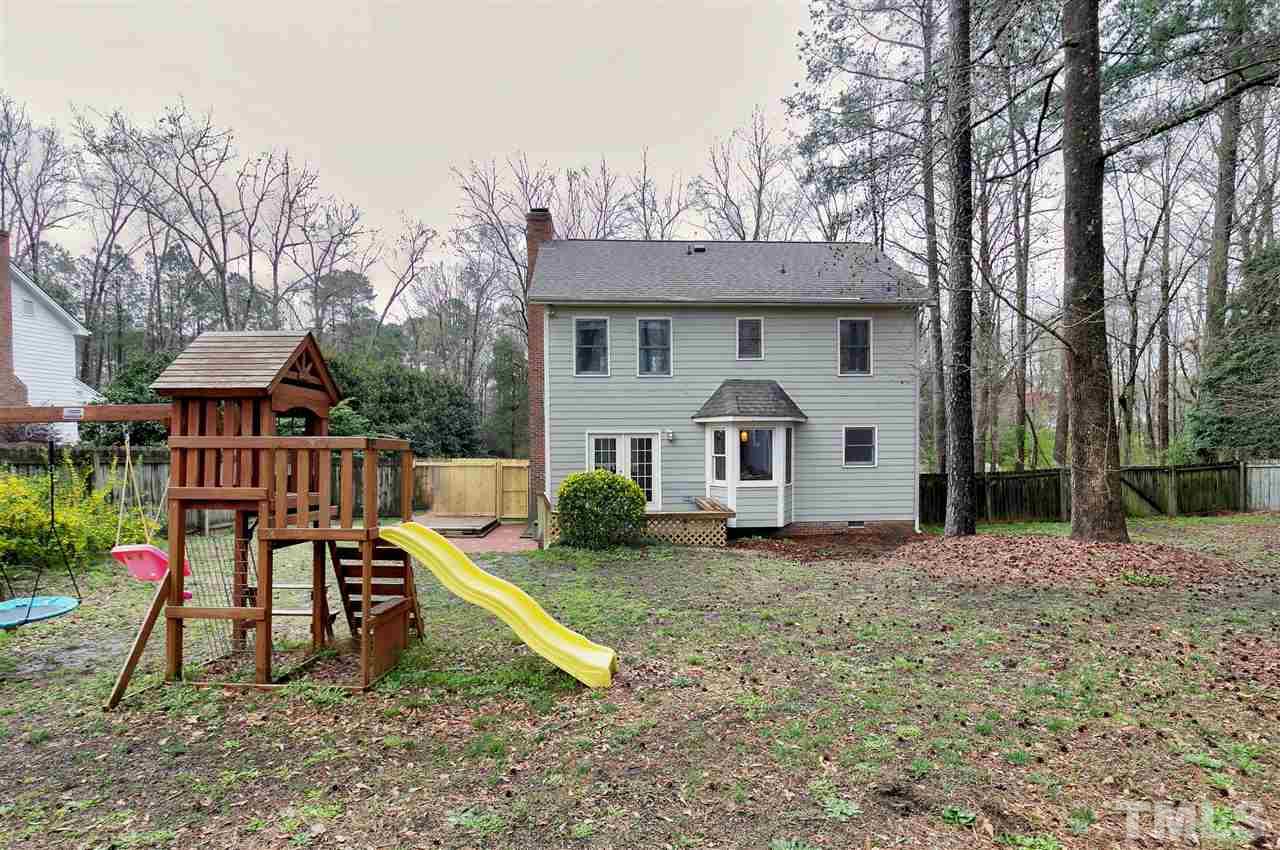 517 South Meadow Road Raleigh, NC 27603 - Photo 22 of 26 a view of a house with backyard and a slide