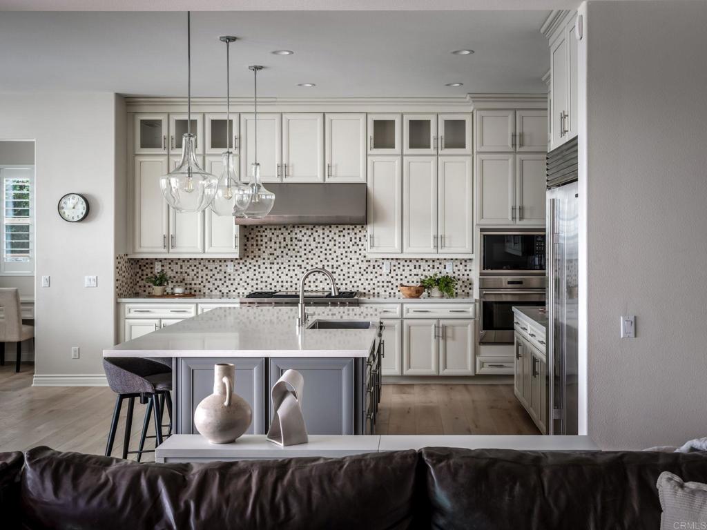 546 Ledge Street San Marcos, CA 92078 - Photo 15 of 75 a kitchen with stainless steel appliances granite countertop a microwave a stove and refrigerator