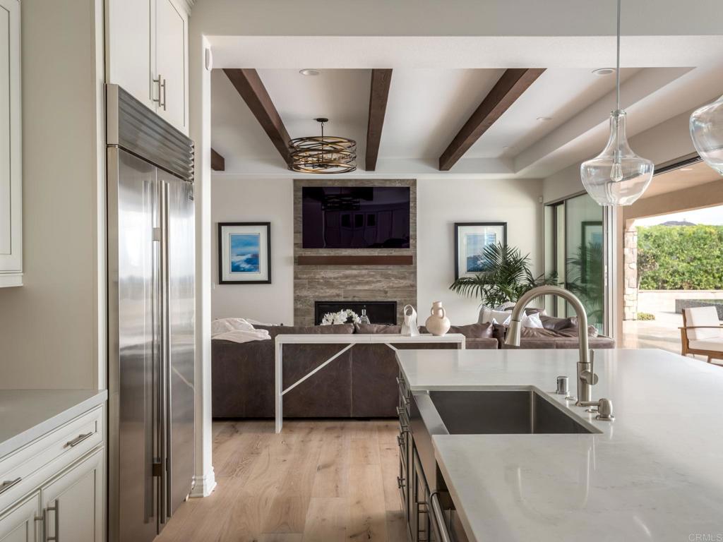 546 Ledge Street San Marcos, CA 92078 - Photo 18 of 75 a kitchen with stainless steel appliances granite countertop a sink and a refrigerator