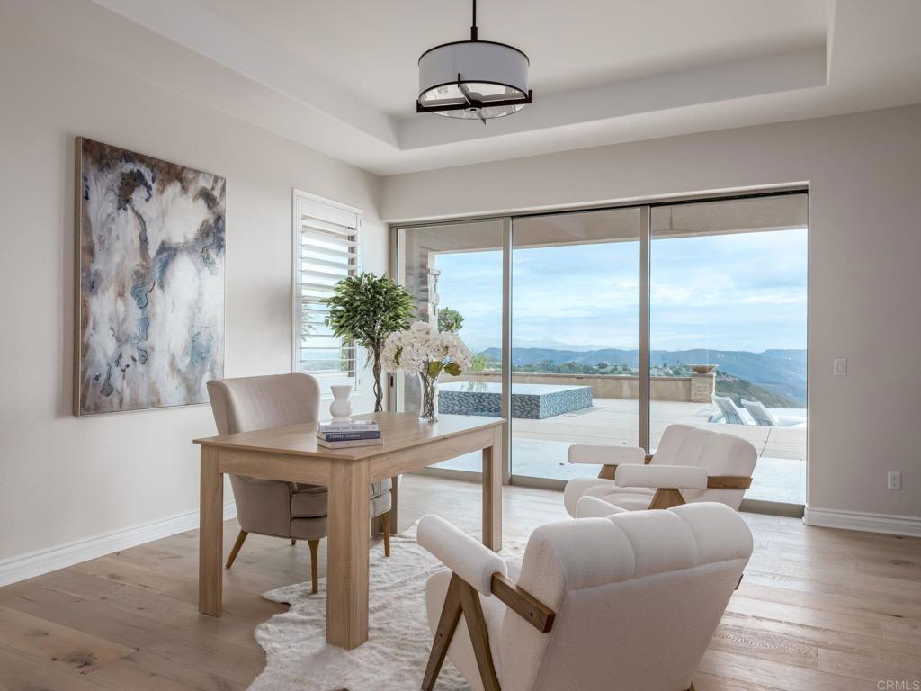 546 Ledge Street San Marcos, CA 92078 - Photo 24 of 75 a dining room with furniture a chandelier and wooden floor