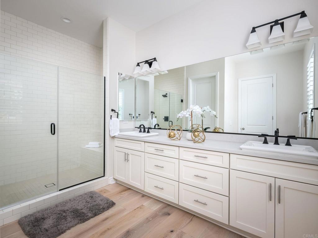 546 Ledge Street San Marcos, CA 92078 - Photo 27 of 75 a bathroom with double sink and a mirror