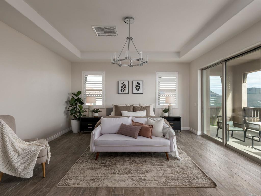 546 Ledge Street San Marcos, CA 92078 - Photo 29 of 75 a living room with furniture and a chandelier