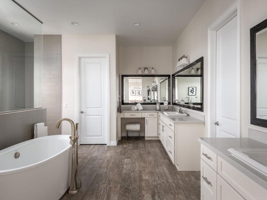 546 Ledge Street San Marcos, CA 92078 - Photo 35 of 75 a large white kitchen with a lot of counter space and appliances