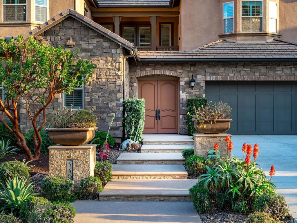 546 Ledge Street San Marcos, CA 92078 - Photo 4 of 75 a front view of a house with a porch