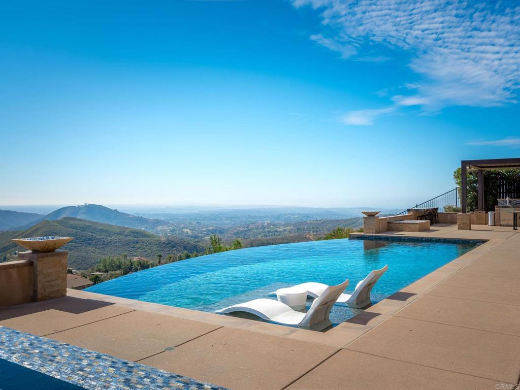 546 Ledge Street San Marcos, CA 92078 - Photo 42 of 75 a view of a swimming pool with lounge chairs