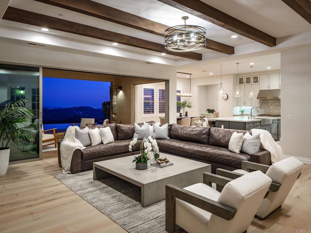 546 Ledge Street San Marcos, CA 92078 - Photo 64 of 75 a living room with furniture and a chandelier