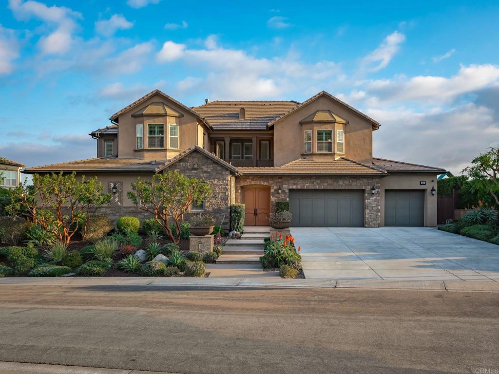 546 Ledge Street San Marcos, CA 92078 - Photo 70 of 75 a front view of a house with a yard and garage