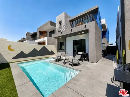 a front view of house with outdoor seating