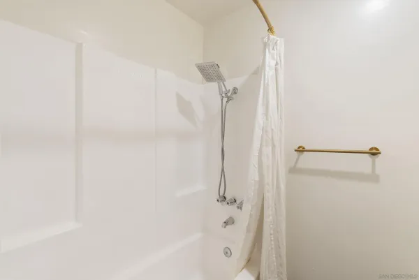 a view of a bathroom from a hallway