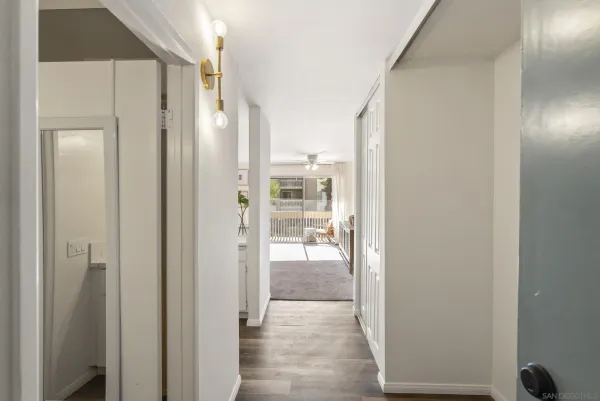a view of a room with wooden floor
