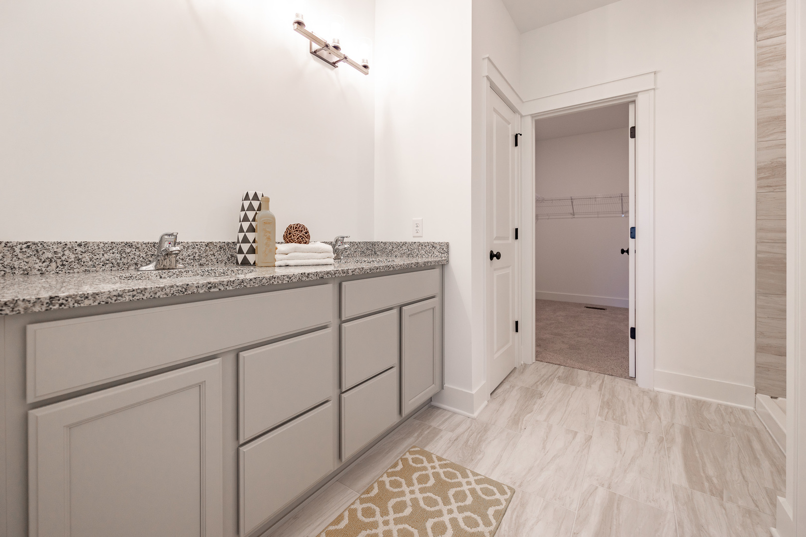 240 Zagreb Avenue Sycamore, IL 60178 - Photo 21 of 30 a spacious bathroom with a granite countertop sink a toilet and a mirror