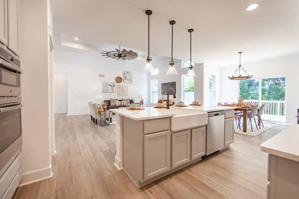 a view of living room with furniture and wooden floor