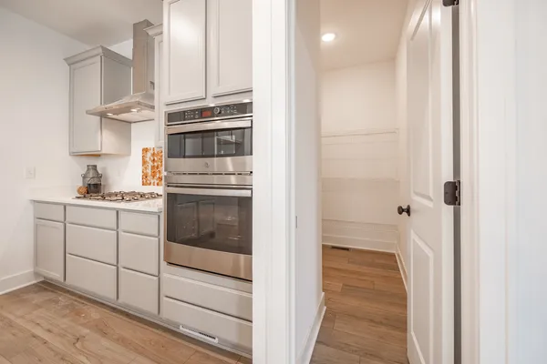 a kitchen with cabinets and stainless steel appliances