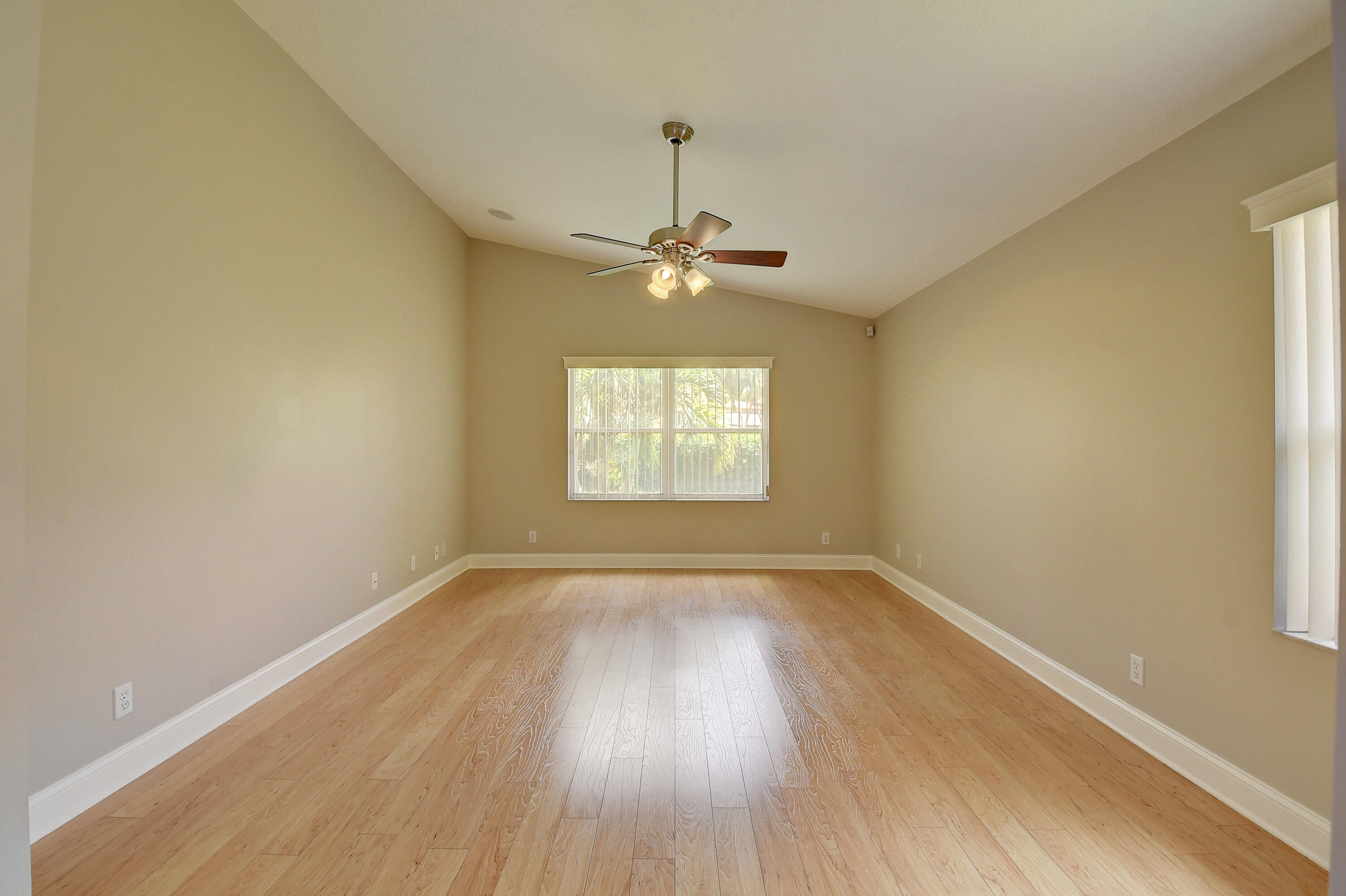 6670 Maybrook Road Boynton Beach, FL 33437 - Photo 13 of 72 wooden floor in an empty room with a window