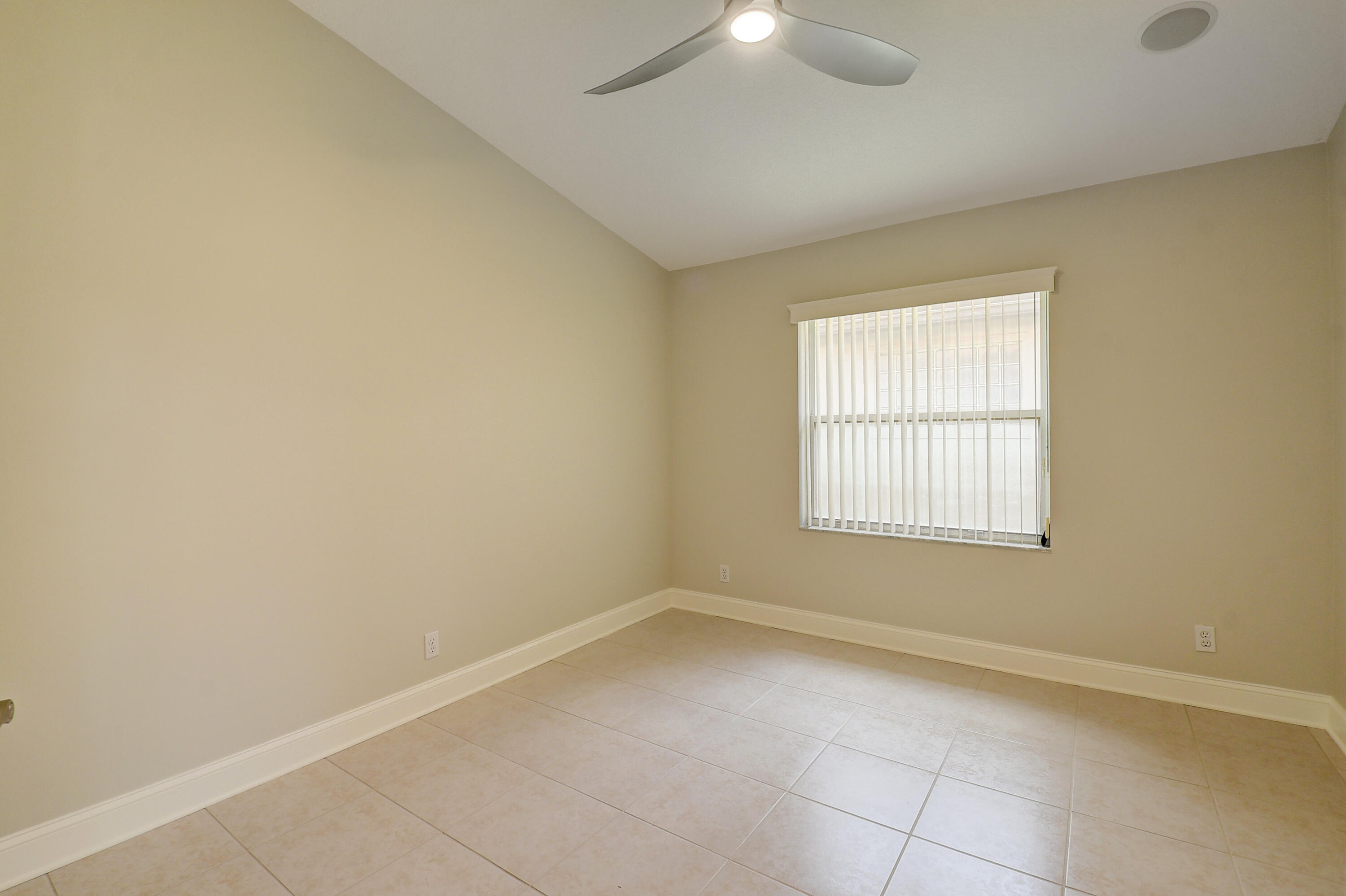 6670 Maybrook Road Boynton Beach, FL 33437 - Photo 16 of 72 an empty room with a empty space and windows