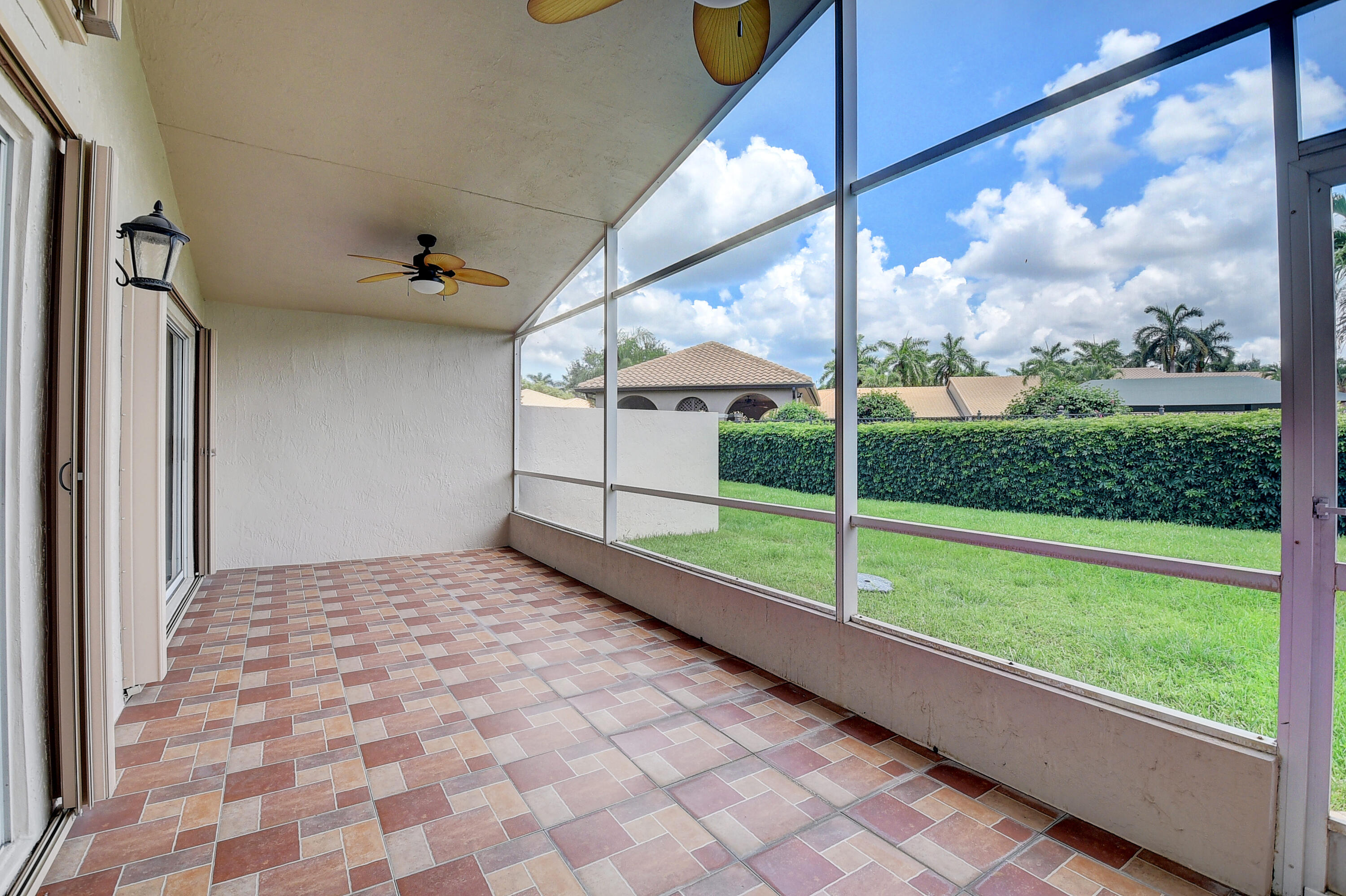 6670 Maybrook Road Boynton Beach, FL 33437 - Photo 22 of 72 a view of a porch with a yard