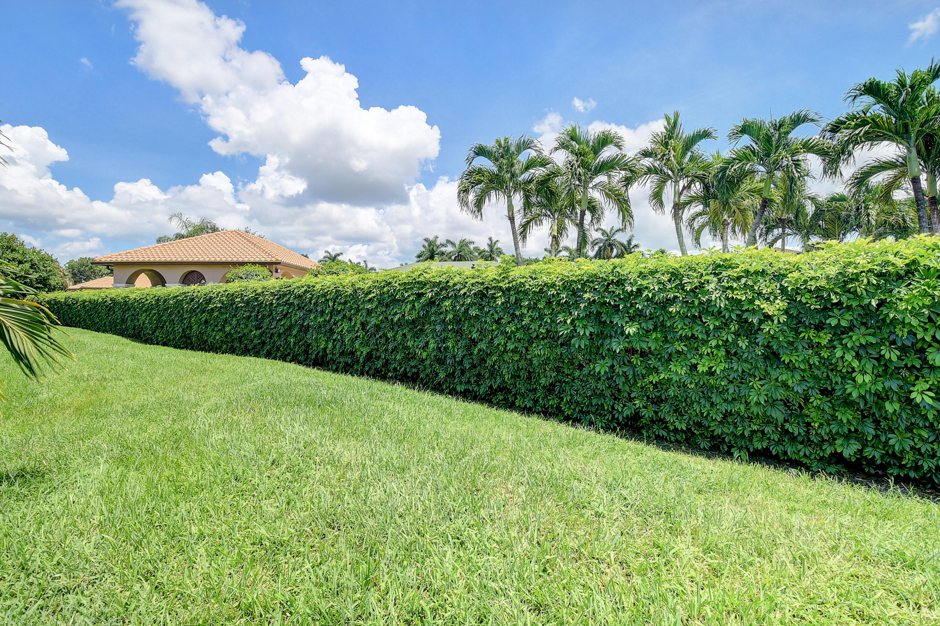 6670 Maybrook Road Boynton Beach, FL 33437 - Photo 30 of 72 a view of a garden