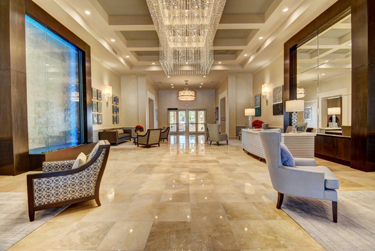 6670 Maybrook Road Boynton Beach, FL 33437 - Photo 37 of 72 a lobby with furniture and a chandelier