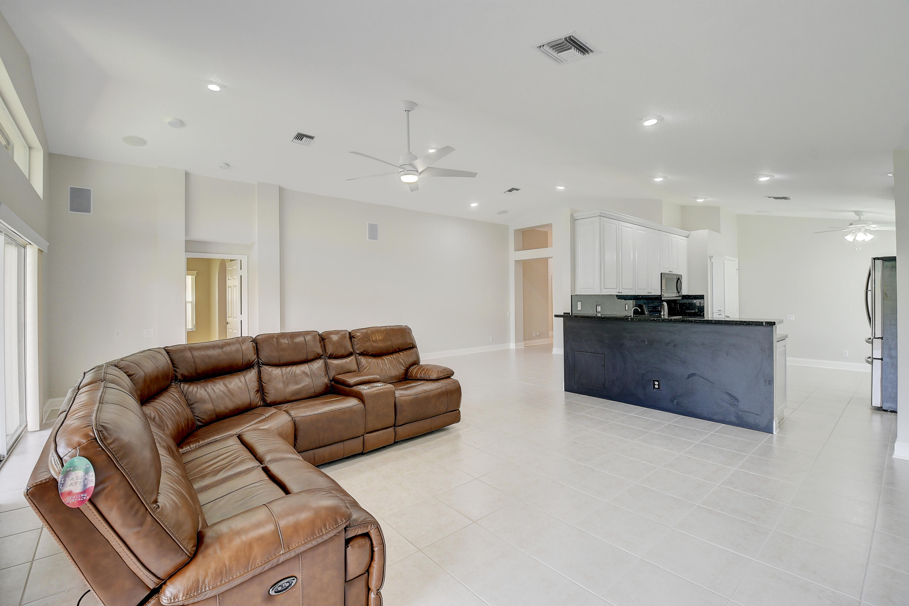 6670 Maybrook Road Boynton Beach, FL 33437 - Photo 4 of 72 a living room with furniture and kitchen view