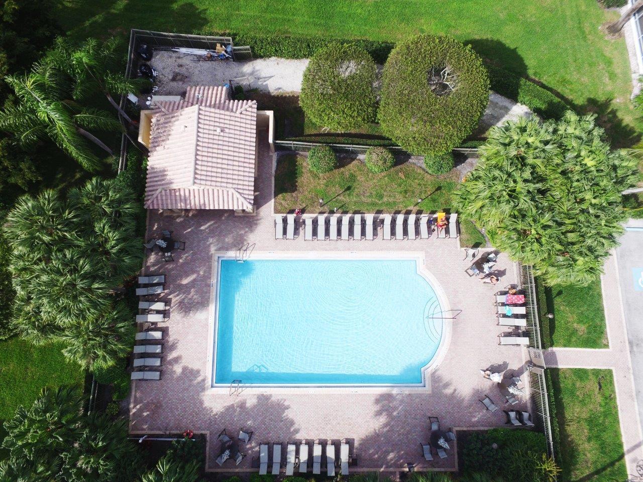 6670 Maybrook Road Boynton Beach, FL 33437 - Photo 47 of 72 an outdoor space with seating area and garden