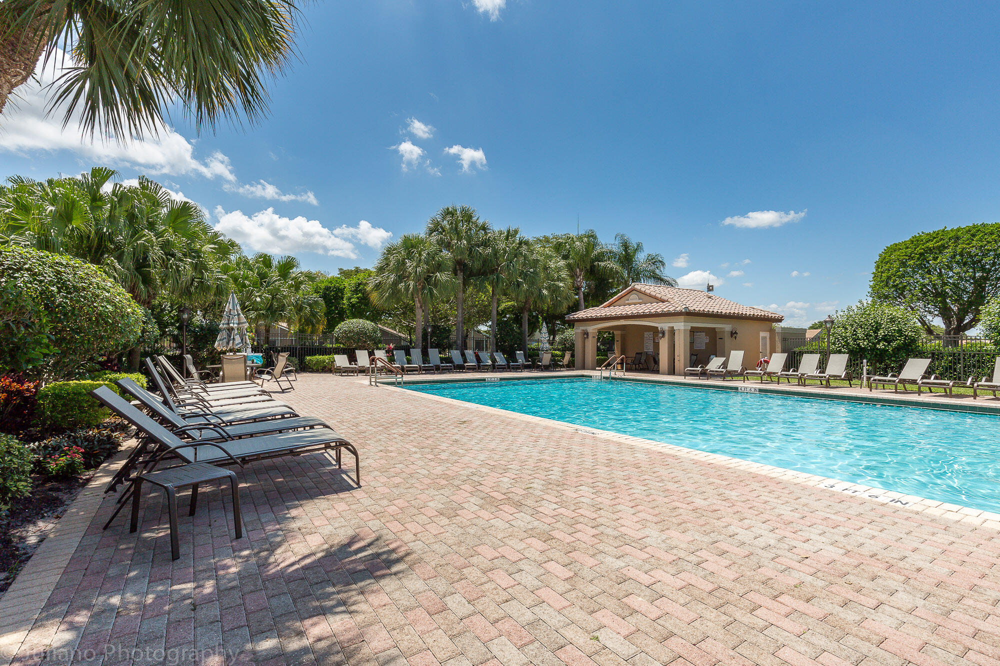 6670 Maybrook Road Boynton Beach, FL 33437 - Photo 48 of 72 a view of a house with swimming pool and sitting area