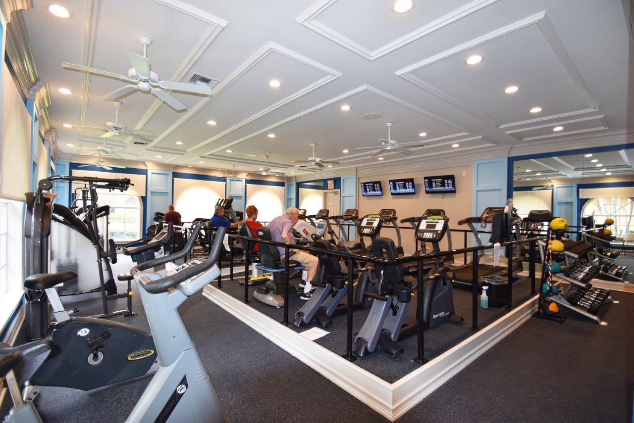 6670 Maybrook Road Boynton Beach, FL 33437 - Photo 54 of 72 a large room with gym equipment and lots of equipment