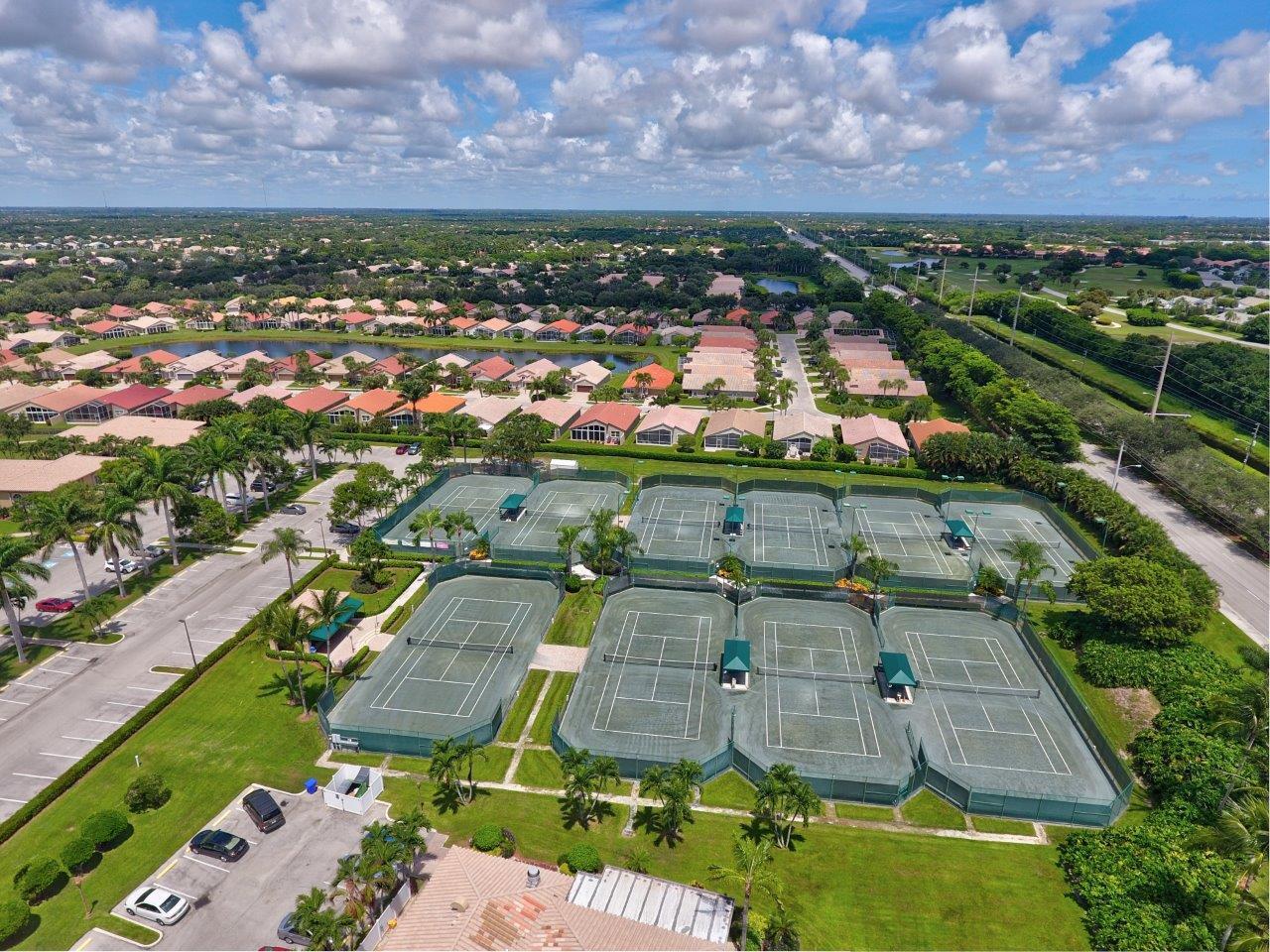 6670 Maybrook Road Boynton Beach, FL 33437 - Photo 57 of 72 an aerial view of residential houses with outdoor space and a lake view