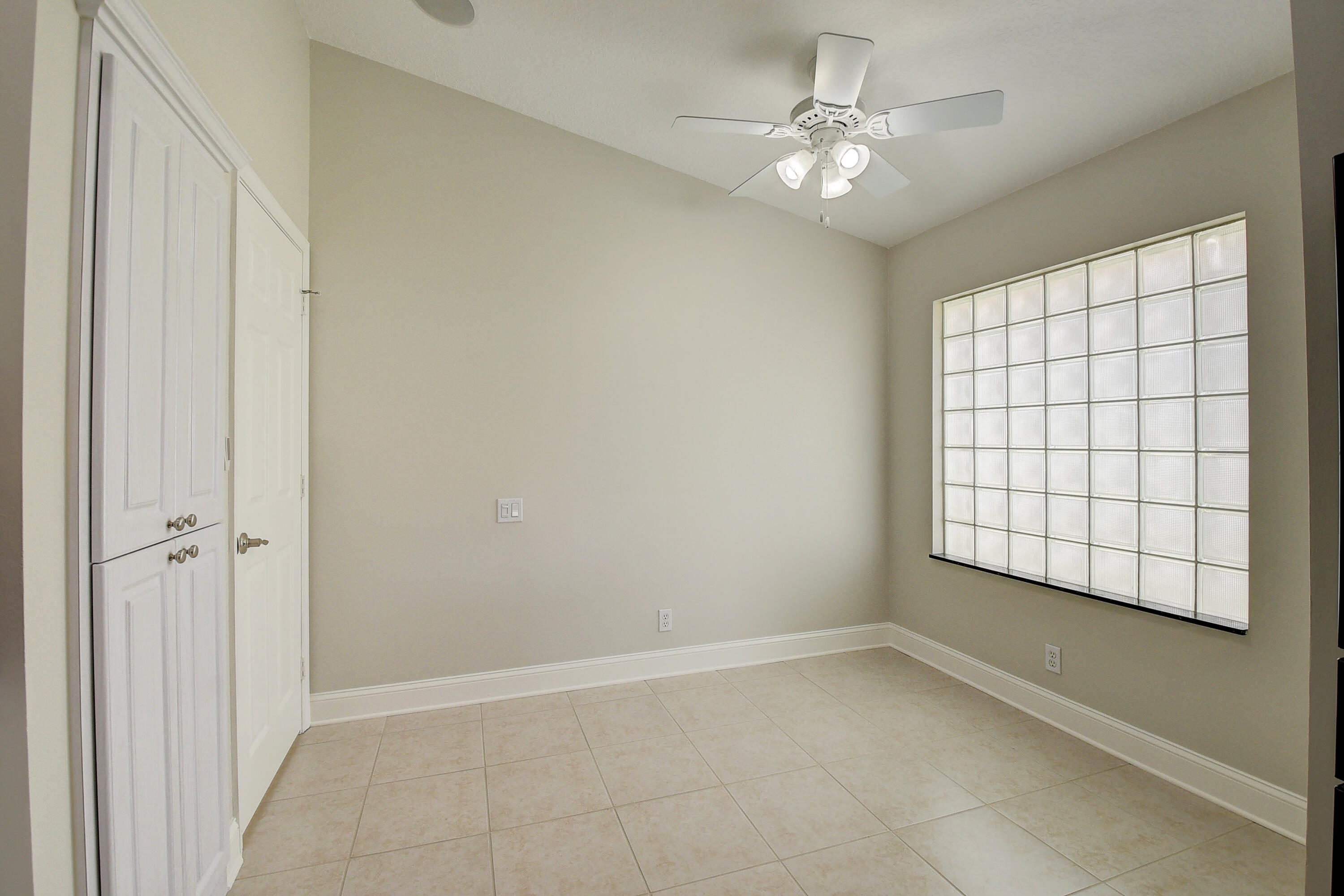 6670 Maybrook Road Boynton Beach, FL 33437 - Photo 6 of 72 a view of an empty room with a window