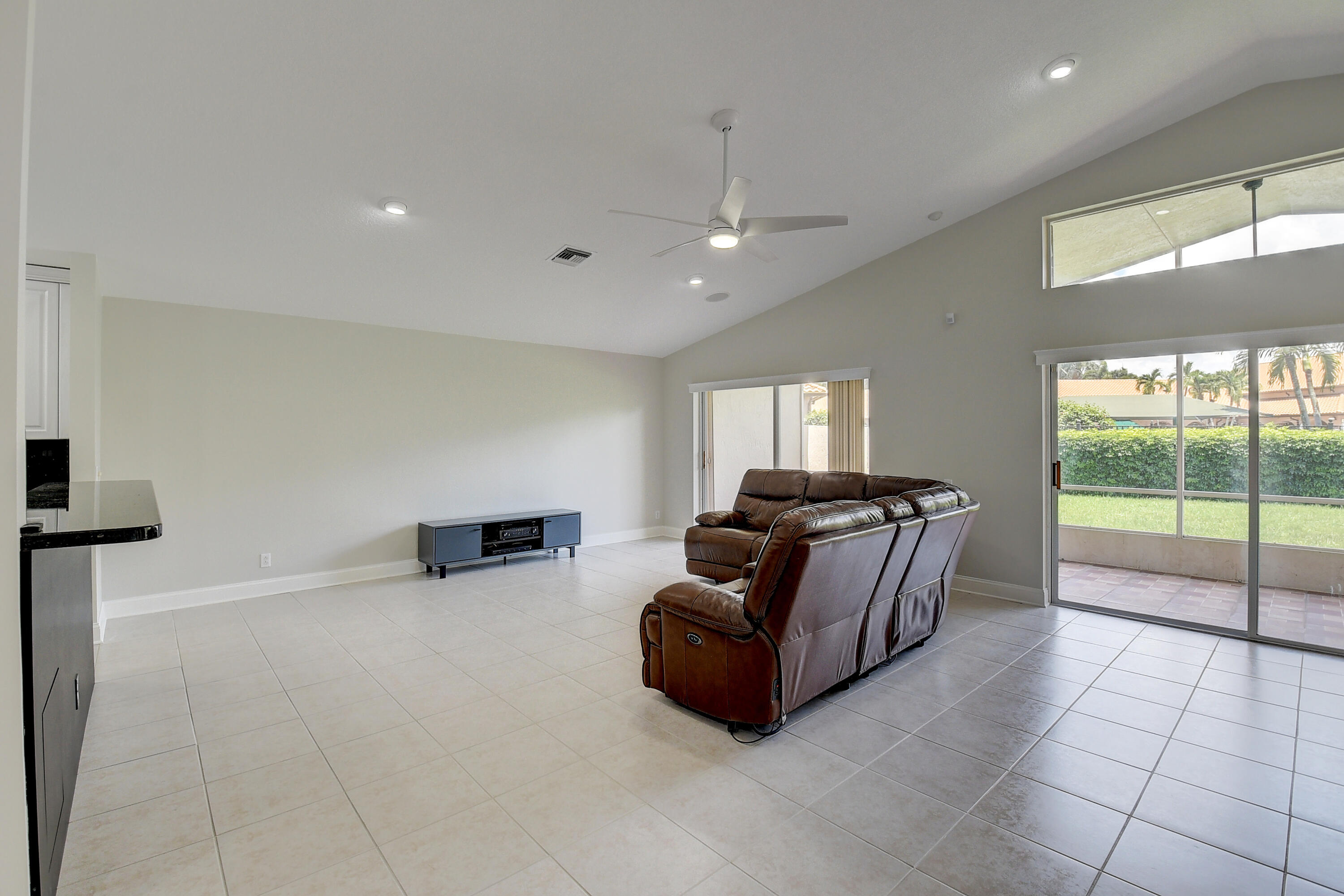 6670 Maybrook Road Boynton Beach, FL 33437 - Photo 8 of 72 a living room with furniture and a floor to ceiling window