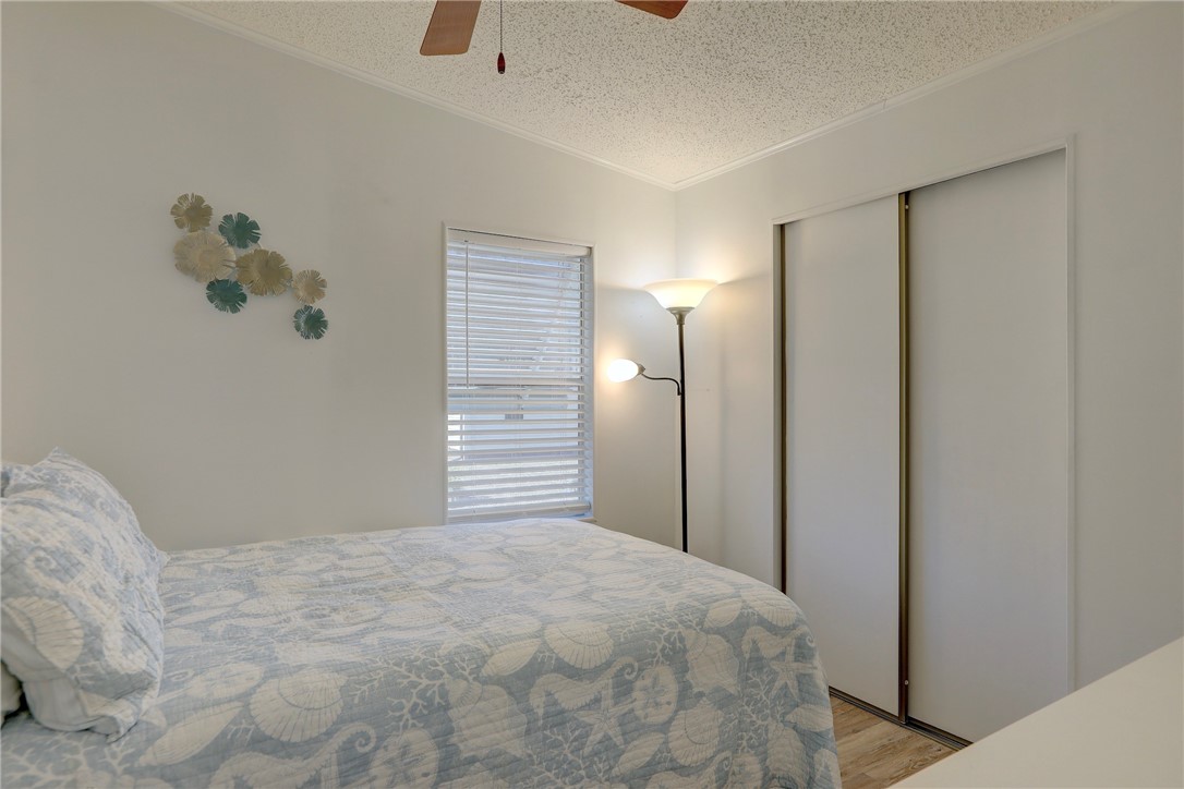 7576 Chasta Road Micco, FL 32976 - Photo 13 of 27 a bedroom with a bed and a window