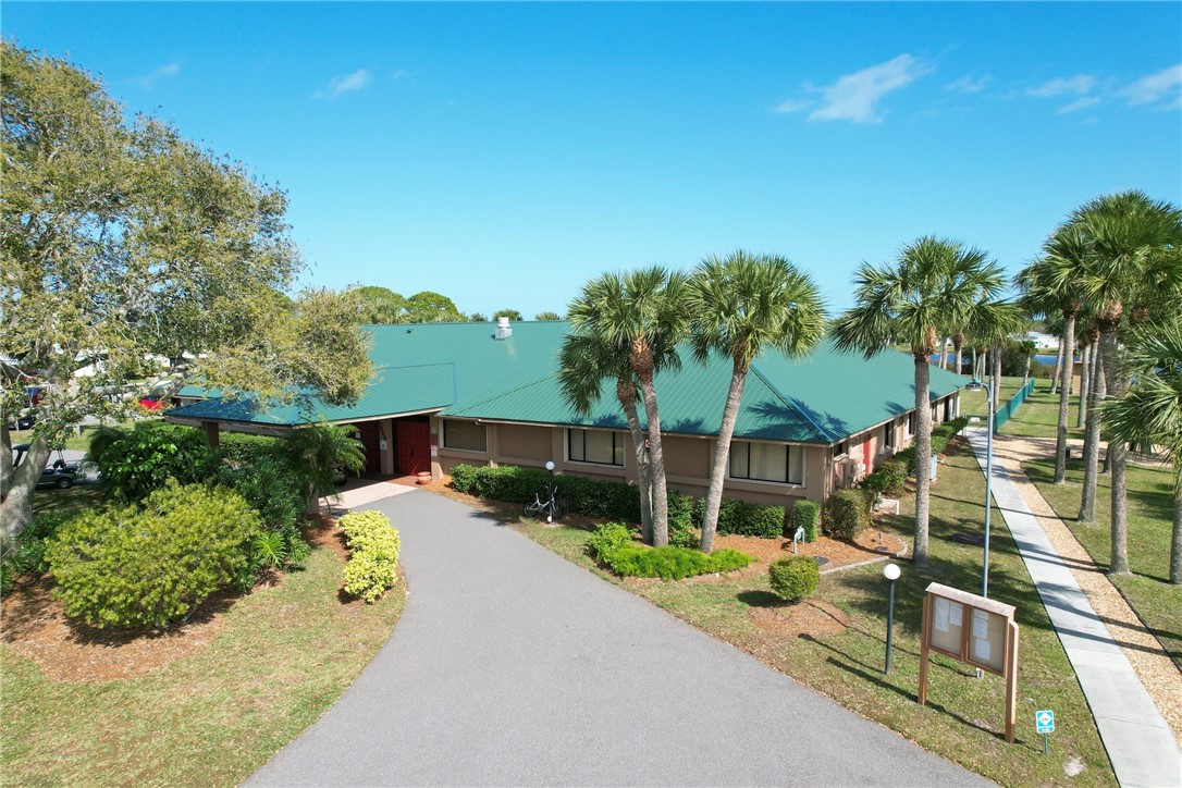 7576 Chasta Road Micco, FL 32976 - Photo 21 of 27 a view of a park with large trees