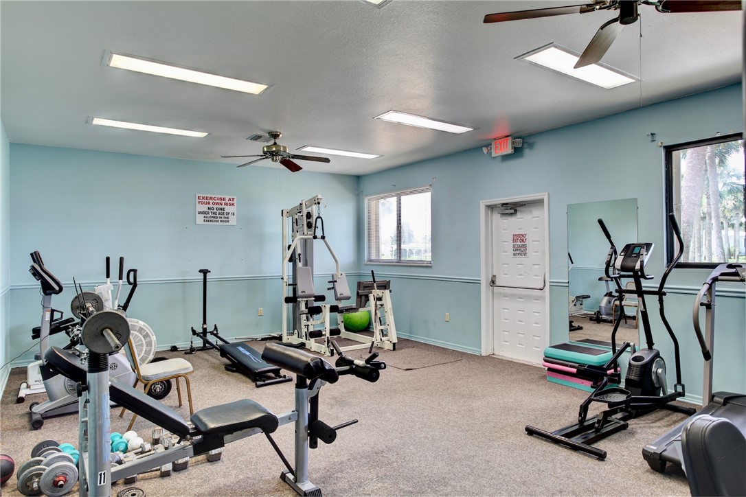 7576 Chasta Road Micco, FL 32976 - Photo 23 of 27 a view of a room with gym equipment