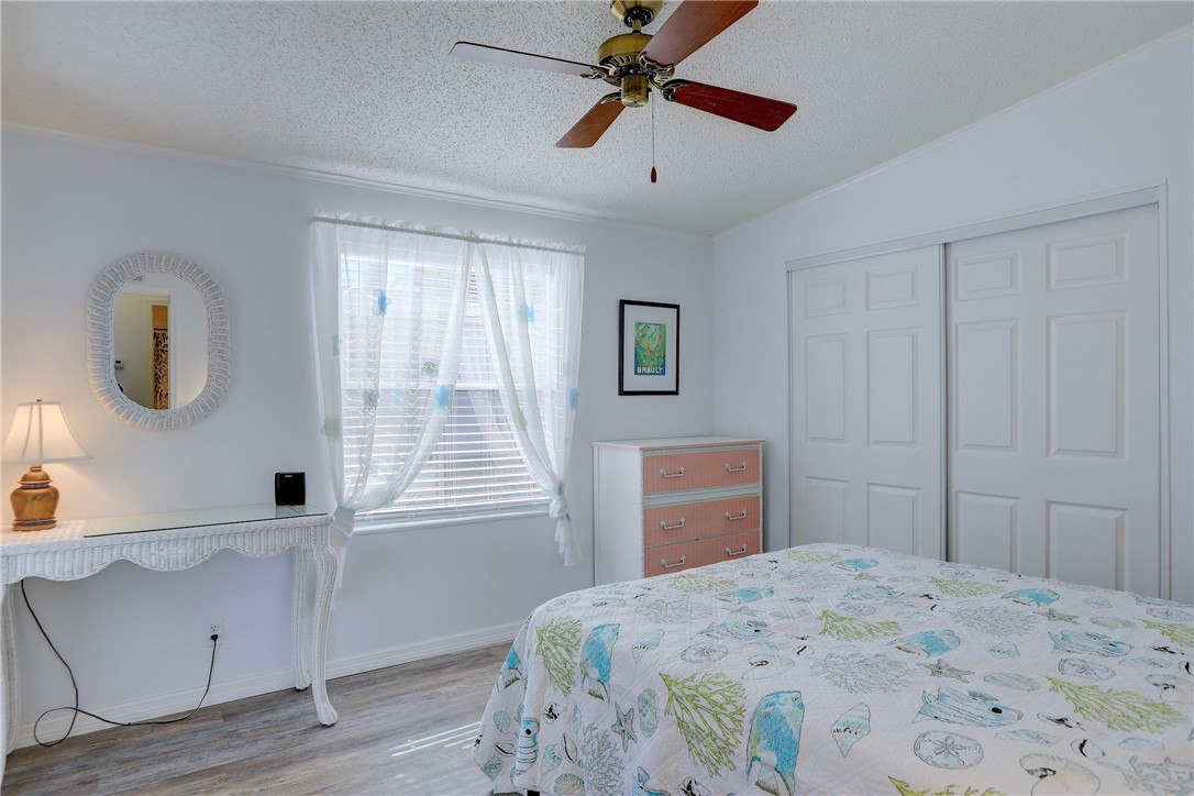 7576 Chasta Road Micco, FL 32976 - Photo 9 of 27 a bedroom with a bed and a window