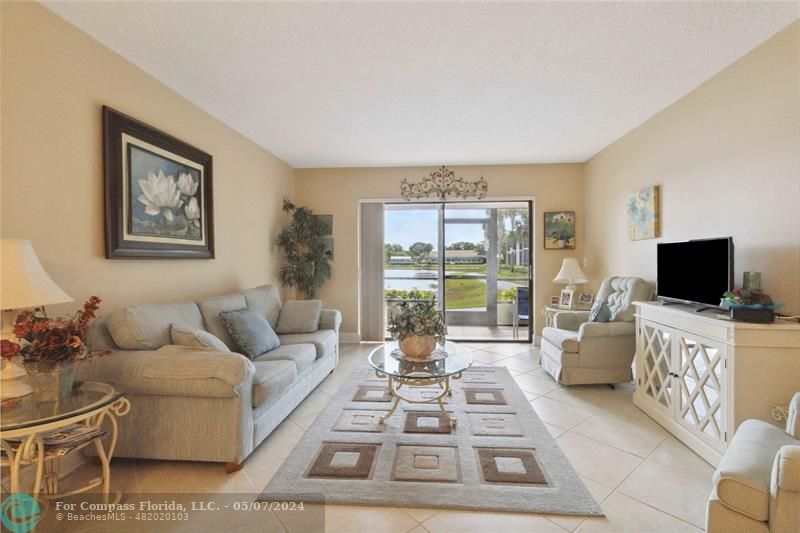 Turn Key living room with screened in Lanai overlooking the lake