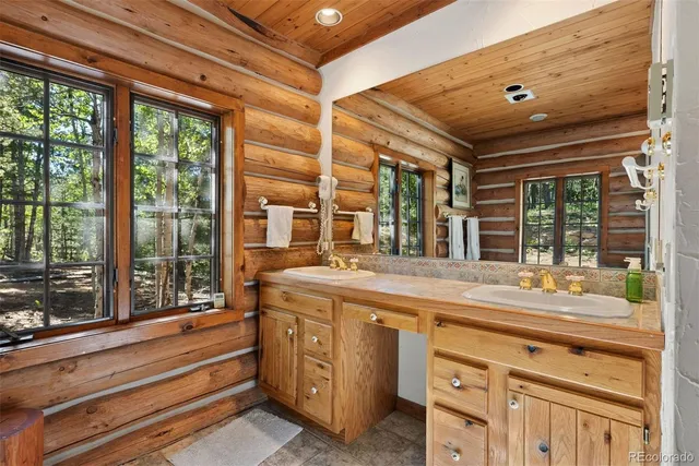 a view of workspace with furniture and windows