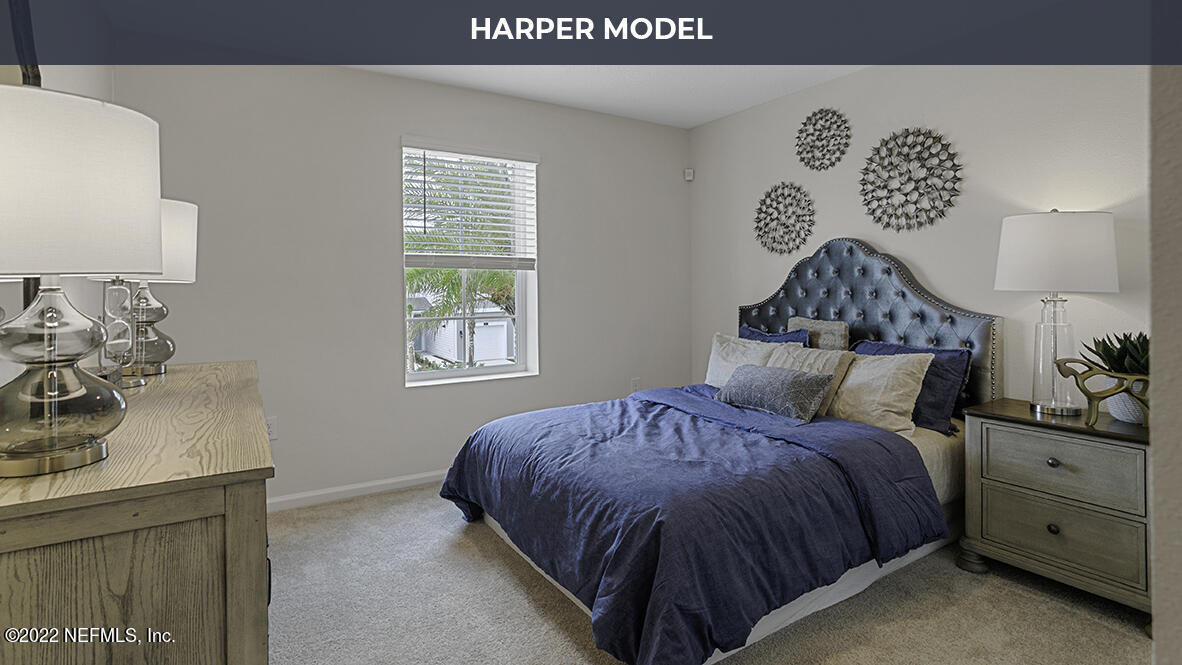 81 Java Lane St. Augustine, FL 32092 - Photo 12 of 31 a bedroom with a bed and window